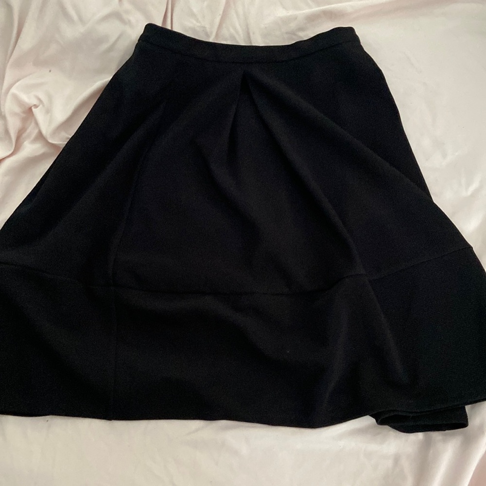 Adorable black skirt goes up to your knees, great material